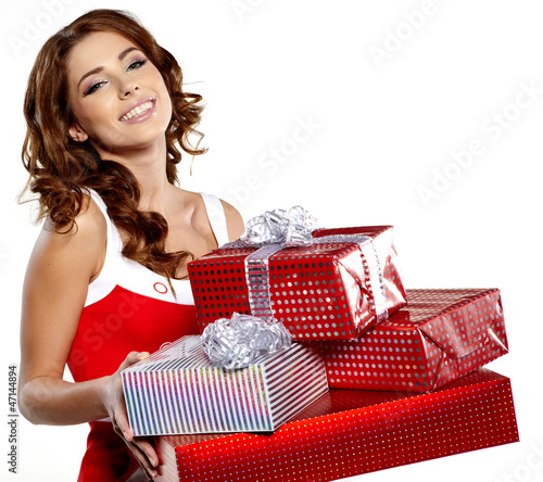 Photo: Beautiful brunette woman with a gift boxes Beautiful brunette woman with a gift boxes