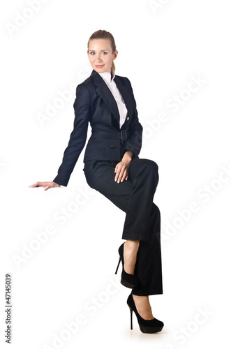 Photo: Woman businesswoman sitting on virtual wall Woman businesswoman sitting on virtual wall
