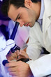 Photo: Doctor in biology working on microscope Doctor in biology working on microscope