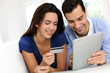 Young couple shopping online from home
