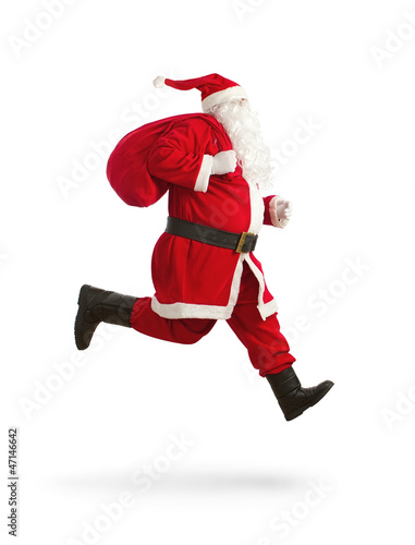 Photo: Santa Claus on the run to delivery christmas presents Santa Claus on the run to delivery christmas presents
