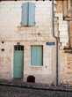 Front door and closed shutters in France