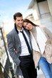 Trendy couple of lovers walking in the street