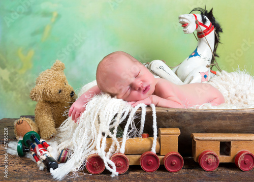 Photo: Old toys and newborn baby Old toys and newborn baby