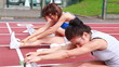 Women stretching on a track