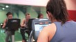 Trainer training with her spinning class