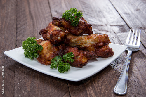 Photo: Heap of Chicken Wings on wood Heap of Chicken Wings on wood