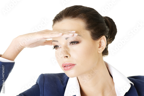 Photo: Business woman looking into the future Business woman looking into the future