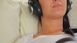 Woman listening to music with unborn child
