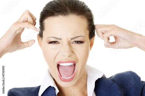 Photo: Stressed or angry businesswoman screaming loud Stressed or angry businesswoman screaming loud