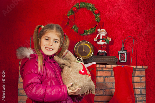 Photo: little girl with Christmas gift little girl with Christmas gift