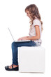 sideview of smiley girl with laptop