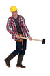 Tradesman struggling to lift a mallet