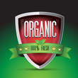 Organic 100 percent fresh on red shield