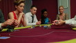 Dealer handing out cards at poker game