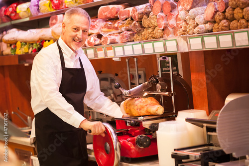 Photo: Shopkeeper at work in a grocery store Shopkeeper at work in a grocery store