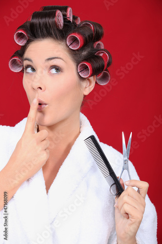 Photo: Woman in bath robe wearing hair rollers Woman in bath robe wearing hair rollers