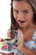 Girl with bowl of candy