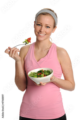 Photo: Young Blond woman holding a bowl of salad Young Blond woman holding a bowl of salad