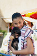 Photo: Little girl holding dog Little girl holding dog