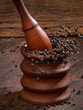 Photo: Grinding black pepper with a mortar and pestle Grinding black pepper with a mortar and pestle