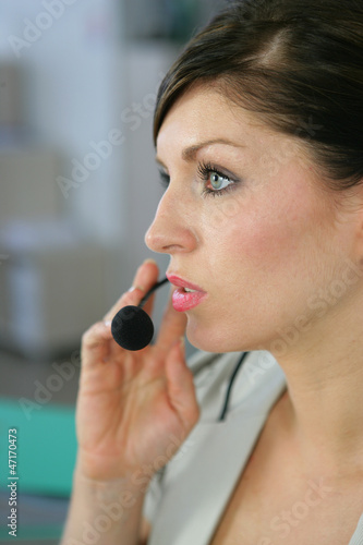 Photo: Portrait of a young woman with a headset Portrait of a young woman with a headset