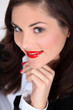 Seductive brunette with bright red lipstick