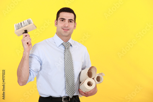 Photo: Man holding wallpaper Man holding wallpaper