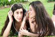 Photo: Two happy girls listening music Two happy girls listening music