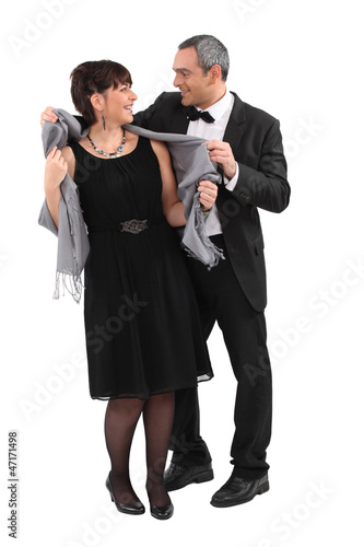 Photo: Couple leaving for an evening event Couple leaving for an evening event