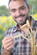 Closeup of smiling man in a cornfield