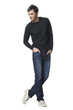 young man in jeans full body a in the studio