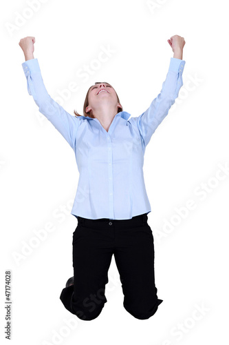 Photo: Woman raised hands in delight Woman raised hands in delight