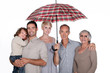 Family under umbrella