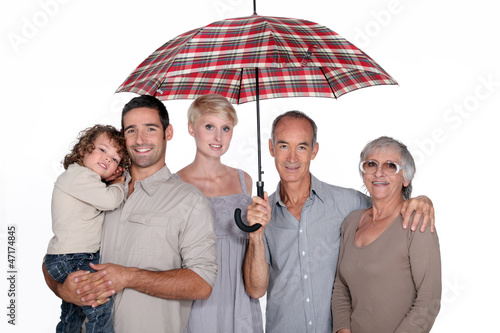 Photo: Family under umbrella Family under umbrella