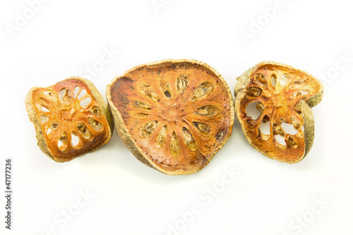 Photo: sliced bael on white background sliced bael on white background