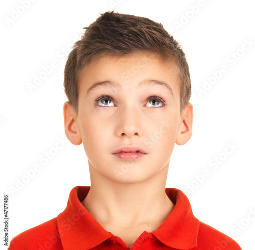 Photo: Portrait of young boy looking up Portrait of young boy looking up