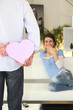 Man offering gift to girlfriend