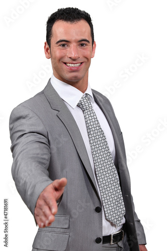 Photo: business man give hand shake business man give hand shake