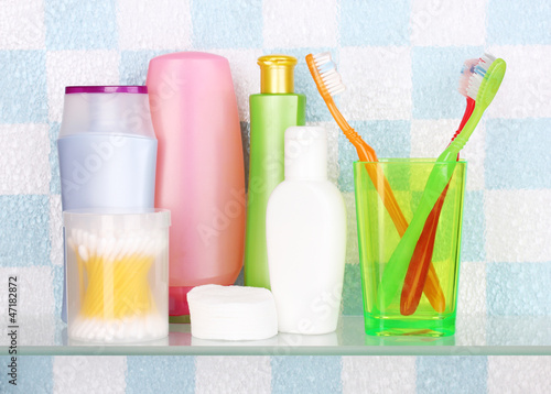 Photo: Shelf with cosmetics and toiletries in bathroom Shelf with cosmetics and toiletries in bathroom