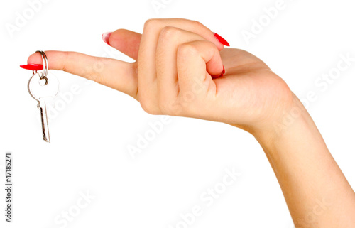 Photo: Hand with key isolated on white Hand with key isolated on white