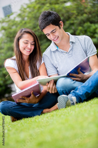 Photo: Couple of students outdoors Couple of students outdoors