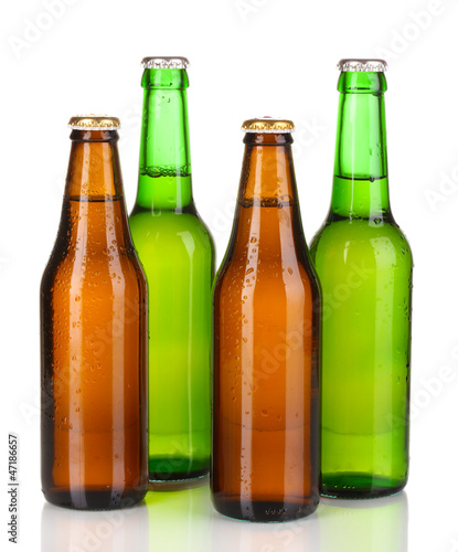 Photo: Coloured glass beer bottles isolated on white Coloured glass beer bottles isolated on white