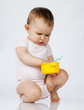 displeased toddler frustrated with her toys