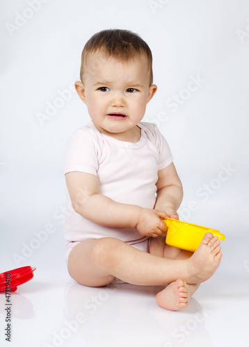 Photo: displeased toddler frustrated with her toys displeased toddler frustrated with her toys