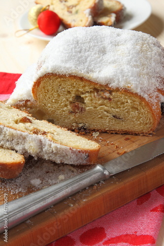 Photo: Traditional German homemade stollen with dried fruits Traditional German homemade stollen with dried fruits