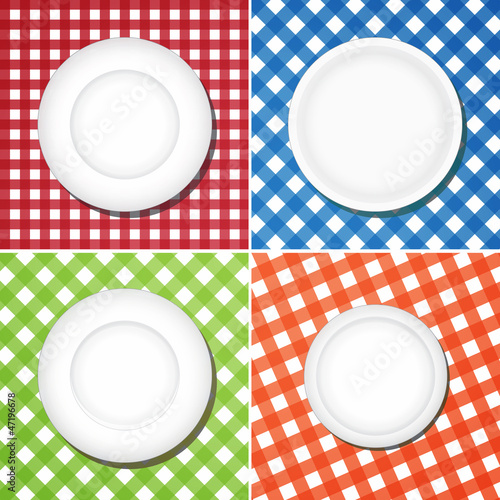 Illustration: White plates on checkered tablecloth White plates on checkered tablecloth