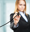 Businesswoman drawing a growing business graph