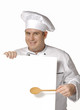 Cocinero chef sujetando una pancarta blanca.