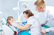 Dentist, medical assistant and a kid